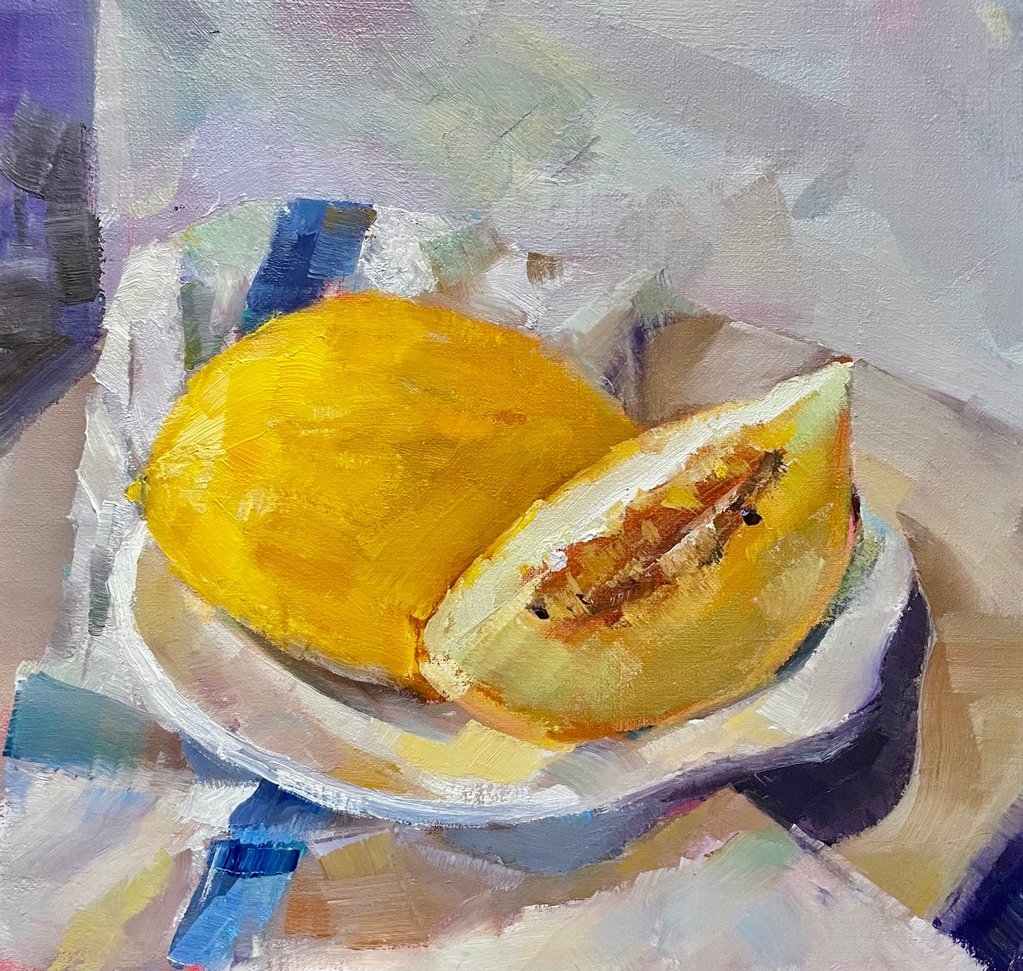 Melon on a striped teacloth