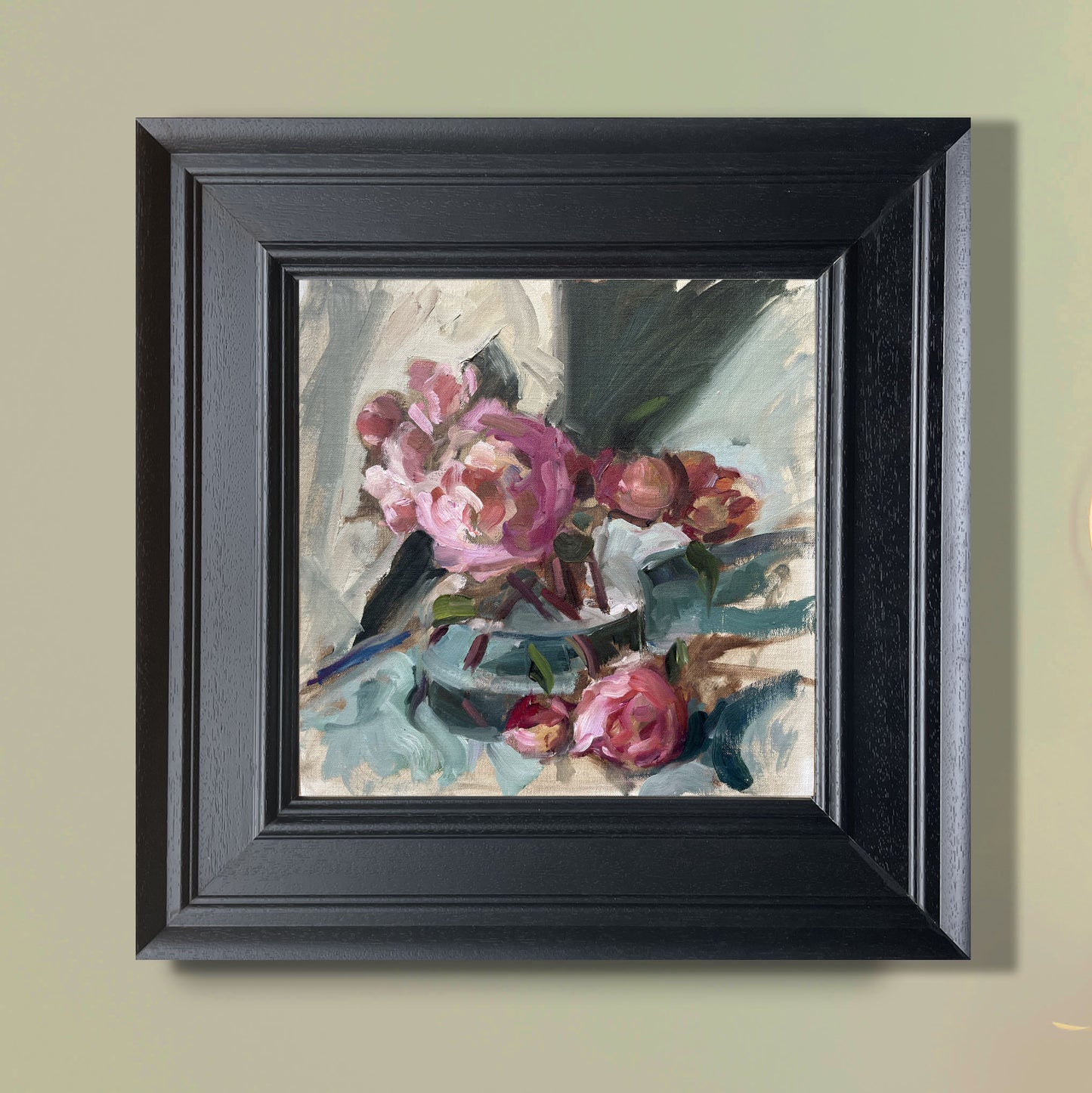 Fading peonies in a glass vase