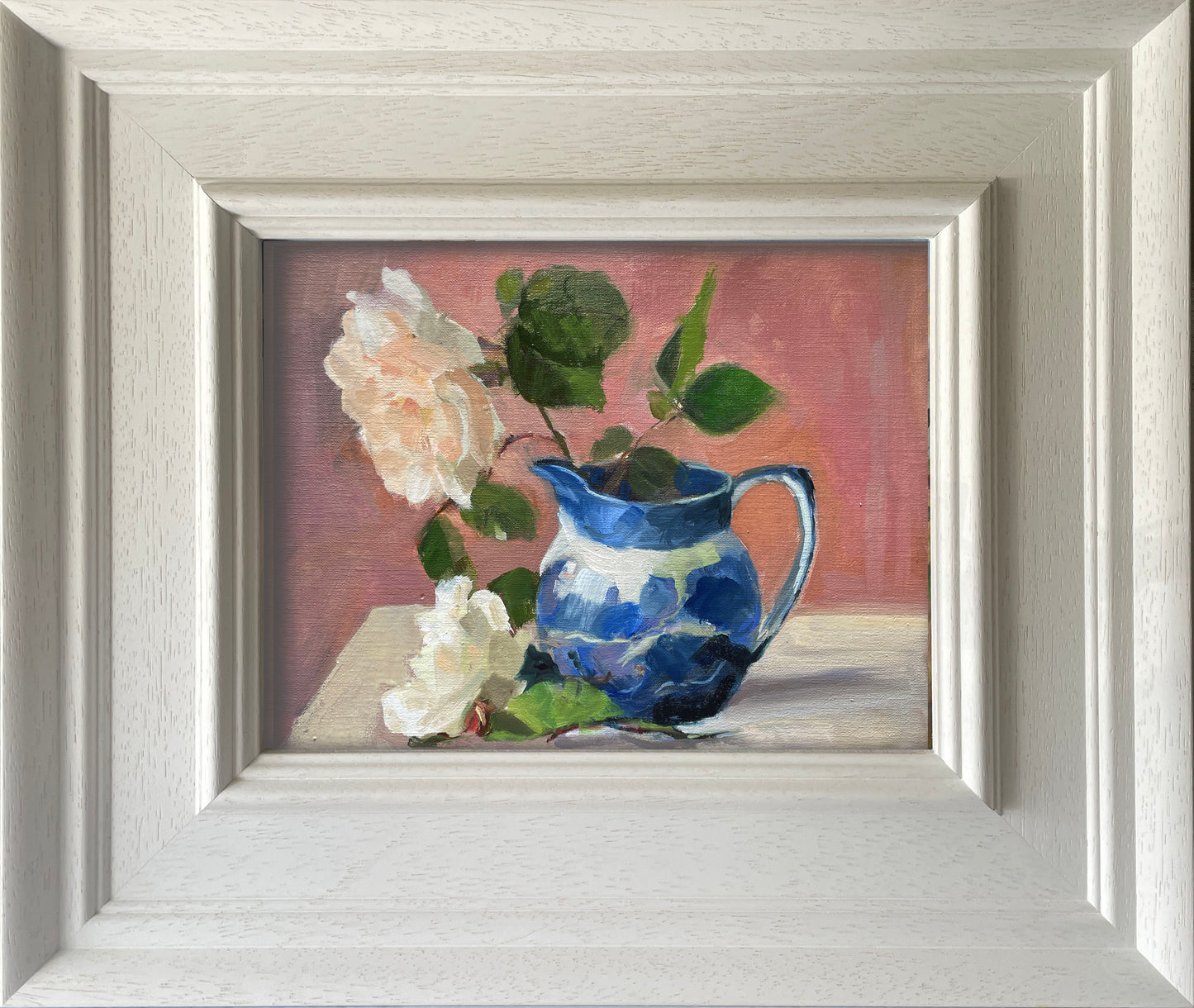 Rose in a blue jug