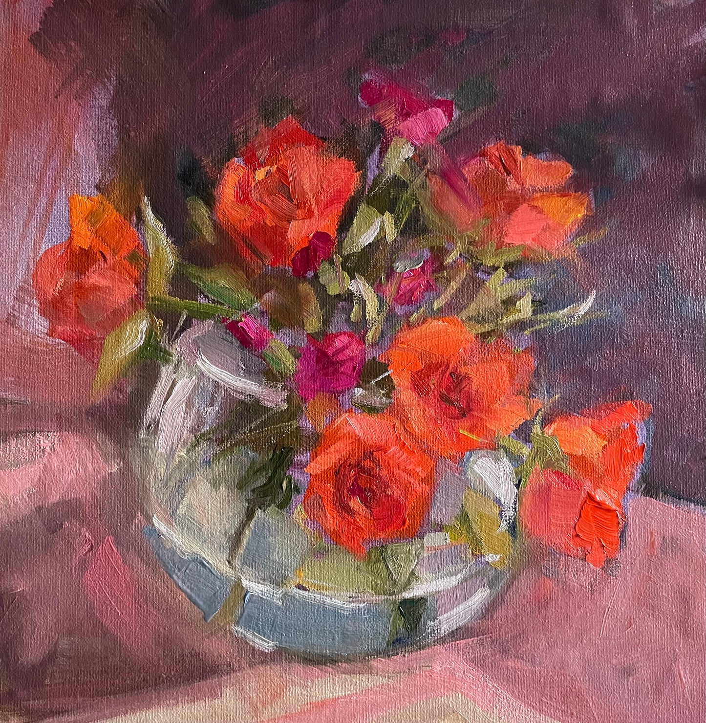 Orange roses in a glass vase