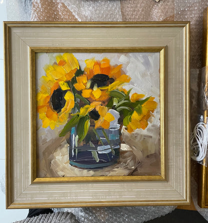 Sunflowers in a blue glass vase